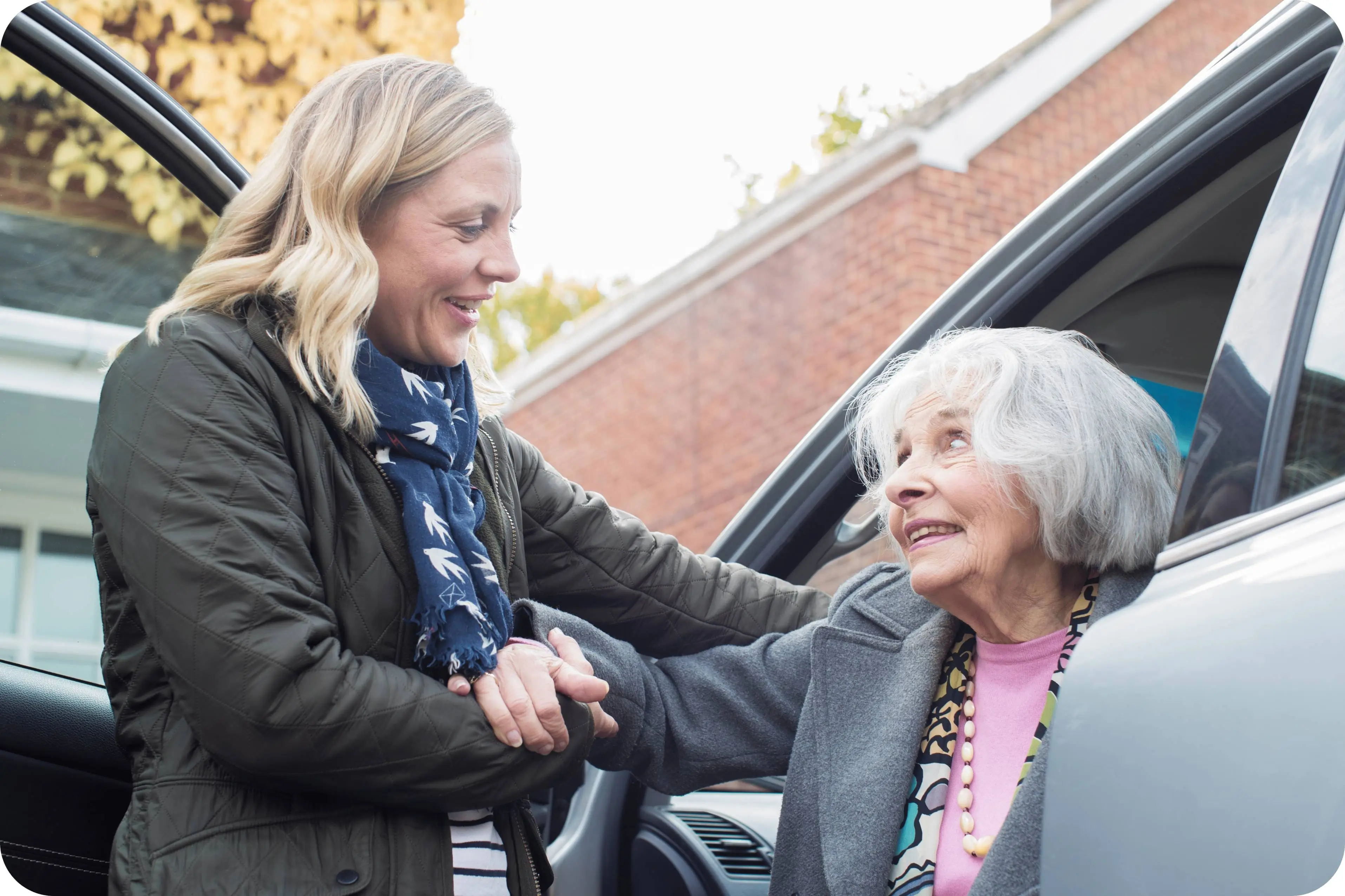 GettyImages-1061255274-modified-2-1 A woman and an older person shaking hands.